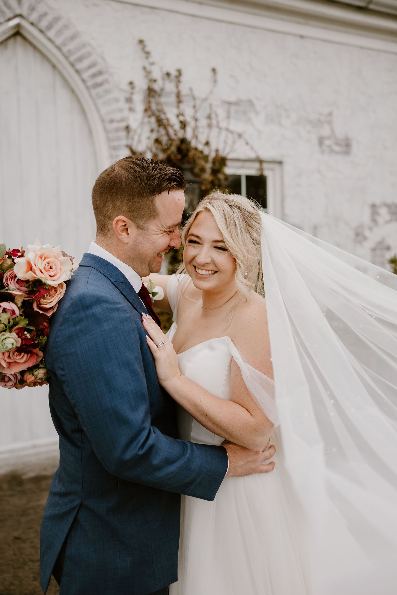 Bride and groom smiling during portraits at Howe Farms Highland Chapel in Chattanooga TN
