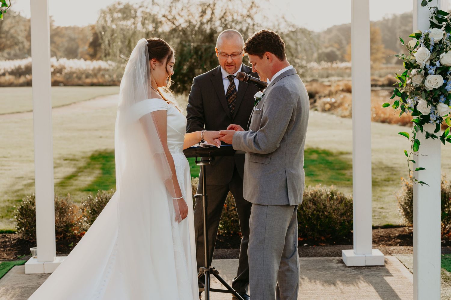 Bride and Groom Photo at a NJ golf course during the Fall Months with cathedral Veil