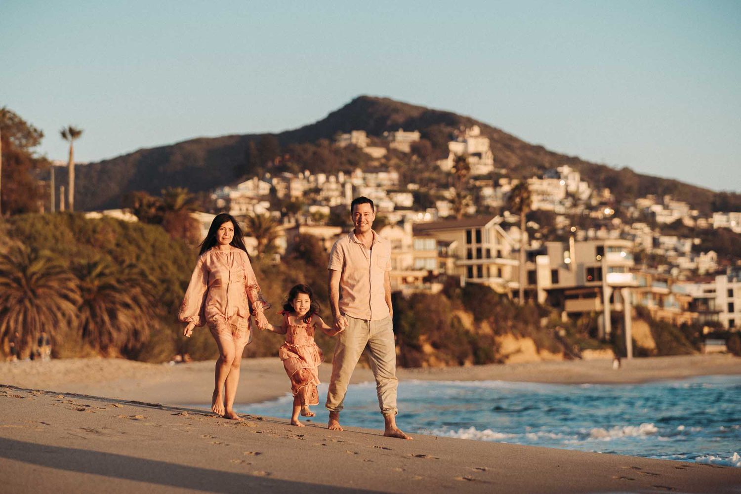 A series of beach photographs showing coastal scenes with people walking along the shoreline at sunset.