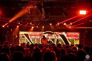Dj playing an event in a warehouse in los angeles