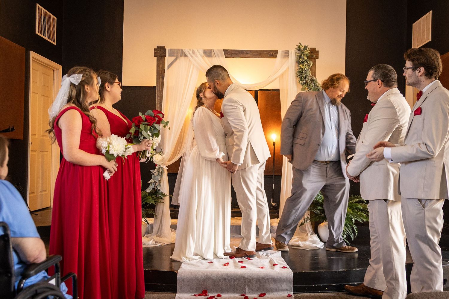 Bride and groom's first kiss at their wedding, shot by their wedding photographer