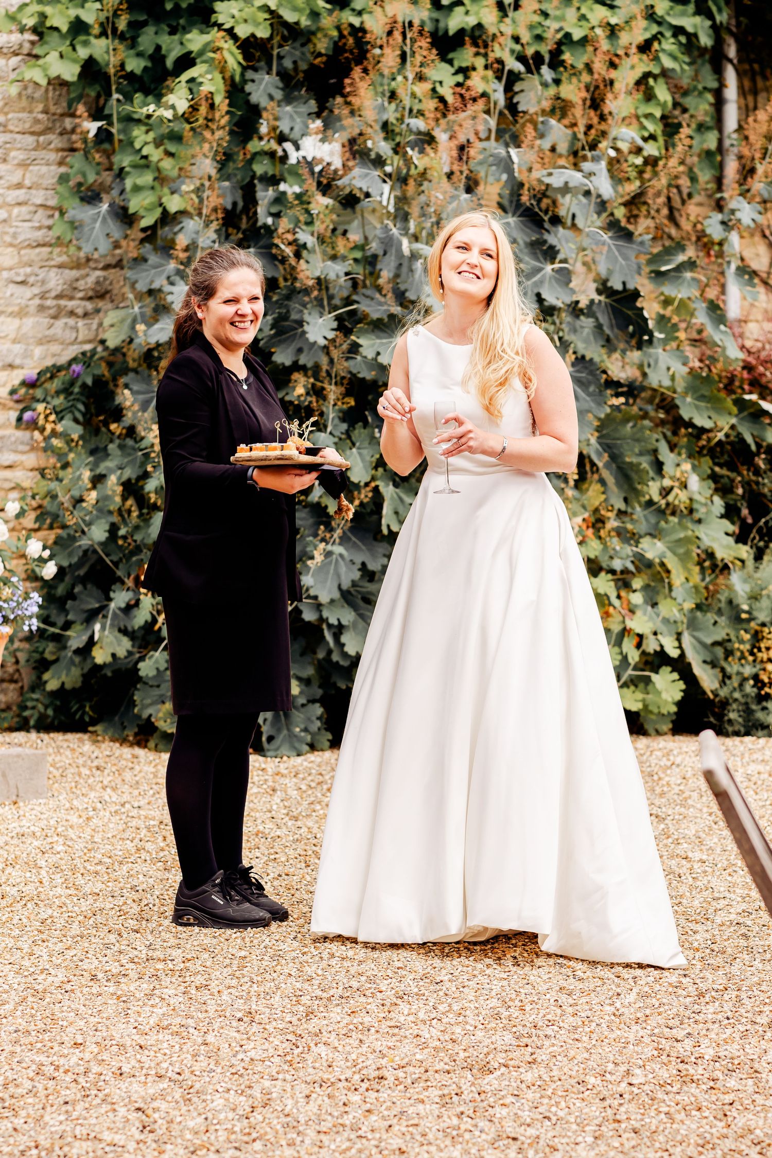 Events Team holding canapes for couple
