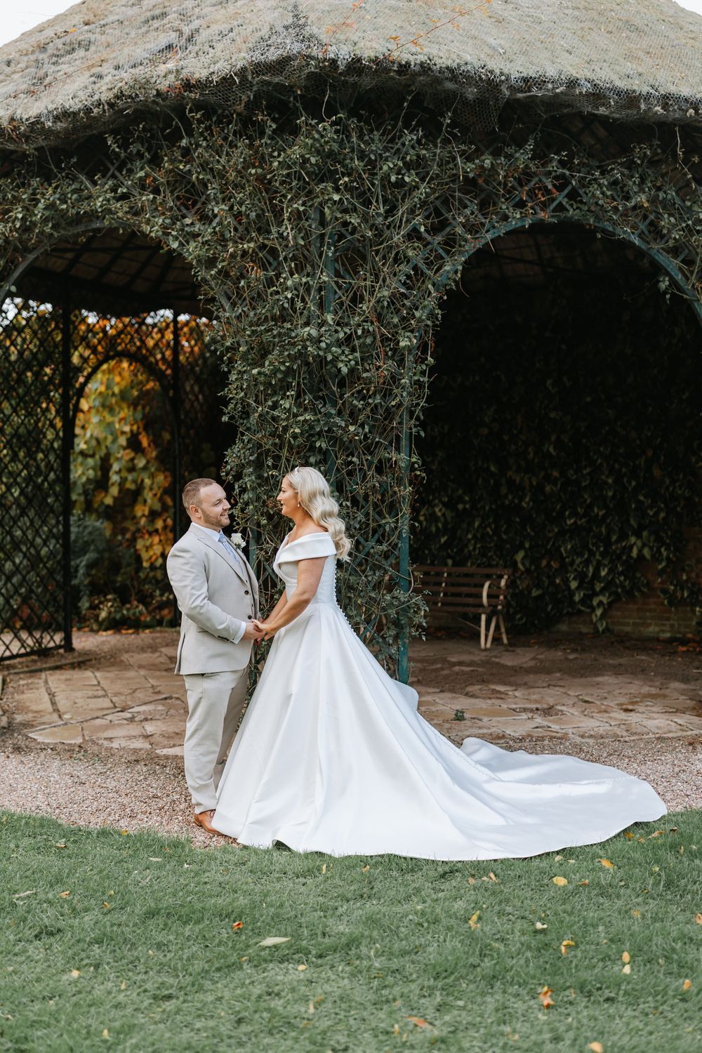 A romantic wedding photo sequence shows a couple in white and grey attire dancing together under trees in a garden setting.