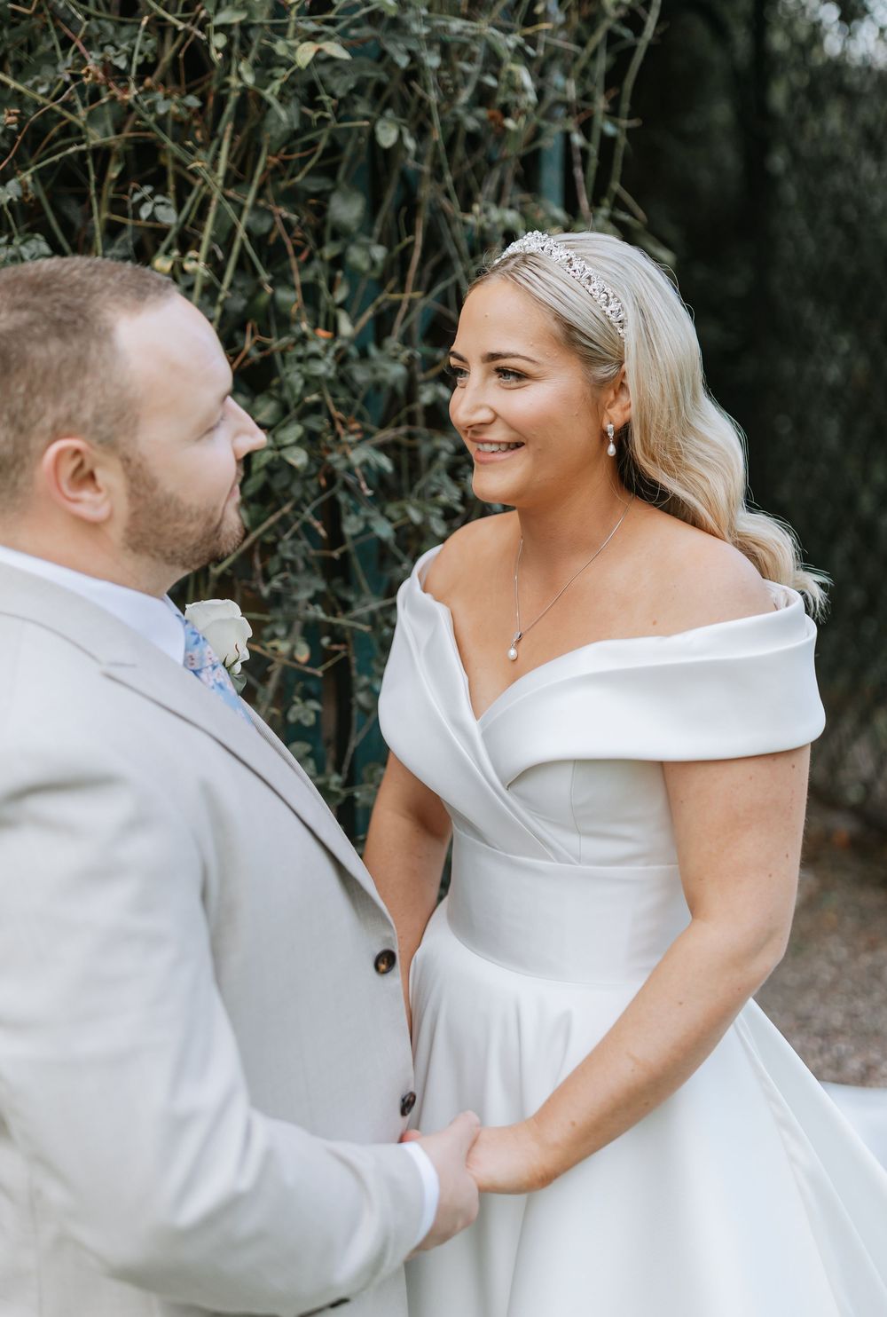 A joyful wedding couple shares intimate moments in a series of candid outdoor portraits.