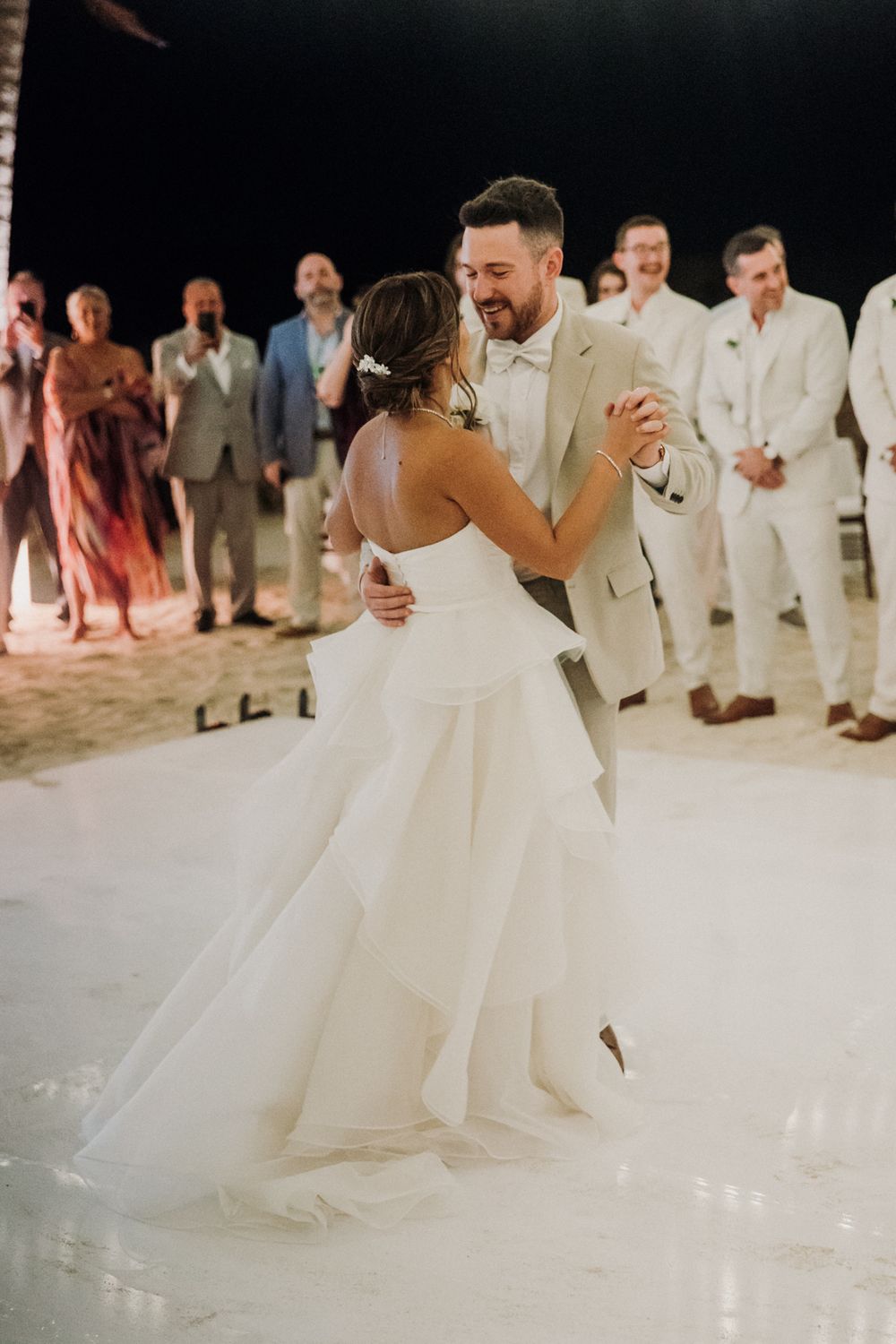 A couple shares their first dance at a wedding reception  El Dorado Royale Wedding Photographer
