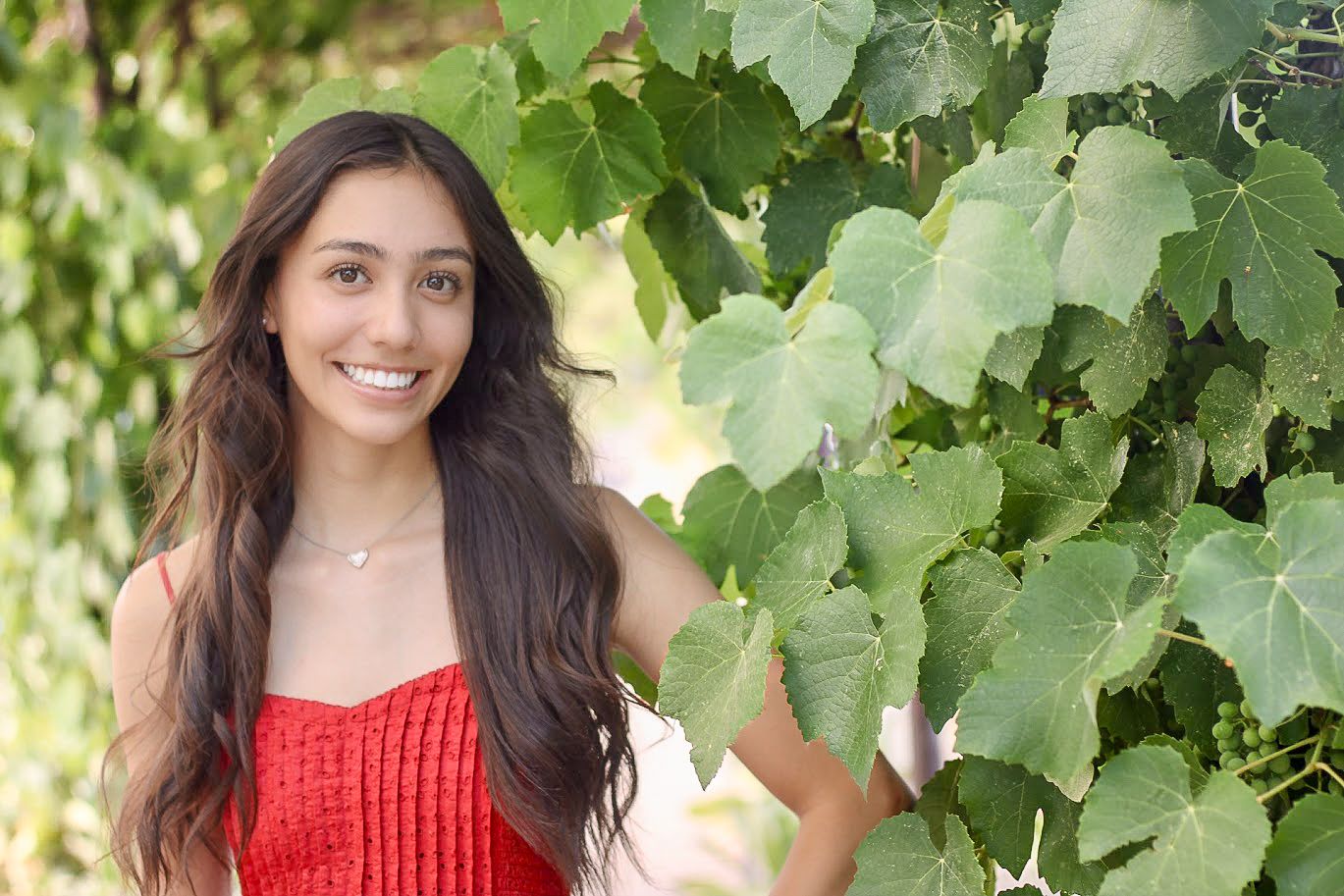 High school senior smiling during an outdoor photo session in Albuquerque, New Mexico