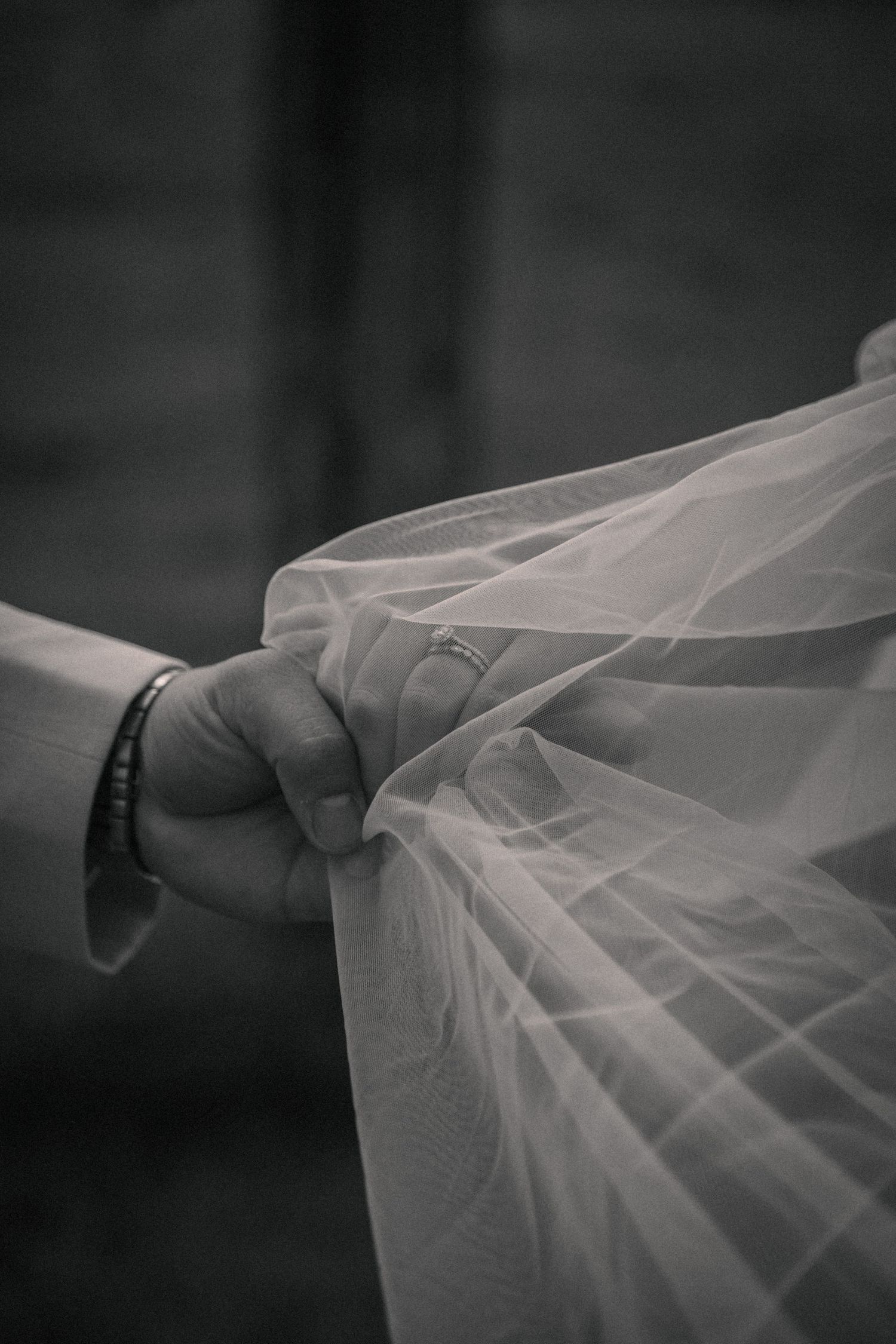 A romantic black and white sequence of a couple dancing together during their wedding celebration.