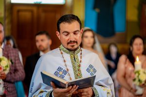 Orthodox wedding ceremony with traditional religious elements and decorative church interior.