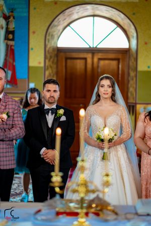 Elegant church wedding ceremony with ornate decorations and candlelight.