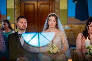 A wedding ceremony moment captured with soft lighting and traditional decor.