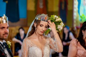 Wedding ceremony with elegant decor and formal attire in an indoor venue.