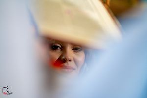 Artistic blurred wedding photography focusing on partial facial features.