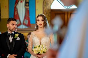 Ornate church interior decorated for a traditional wedding ceremony.