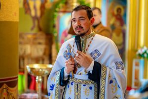 Orthodox priest conducting religious wedding ceremony in traditional vestments.