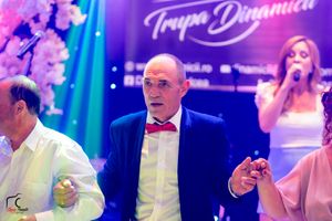 Event space with pink and purple lighting featuring 'Trupa Dinamica' signage.