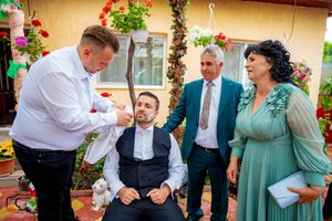 Candid moments captured during an outdoor celebration with guests in formal attire.