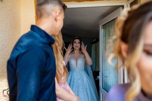 Wedding preparations take place in an indoor setting with formal attire.