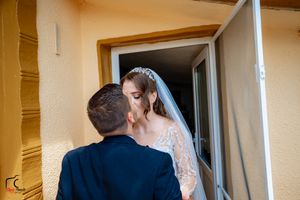 Wedding first look moment unfolding through series of doorway frames.