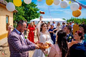 Colorful outdoor celebration with balloons and party decorations in a residential backyard.