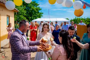 Summer garden party with yellow and white balloon decorations strung overhead.