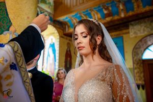 Wedding celebration in a historic church featuring colorful religious murals and decorative elements.
