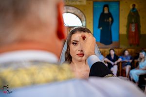 Elegant bridal photography with decorative church walls and artwork in the background.