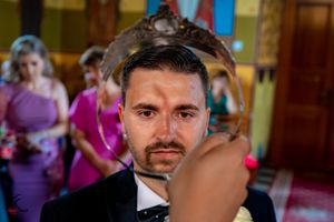 Formal wedding celebration inside a traditional church with vibrant decor.
