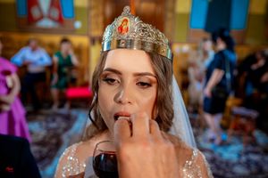 Close-up of ceremonial wine being served during Orthodox wedding ritual.