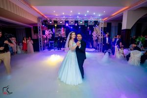 Wedding venue with atmospheric low-lying fog and dramatic purple uplighting.