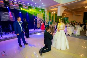 Wedding venue with stunning light display and guests enjoying the celebration.