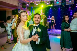 Wedding celebration with vibrant lighting effects and dance floor setup.
