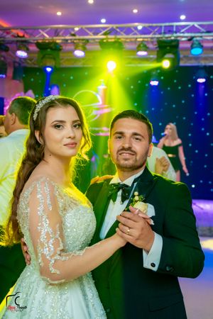 Elegant ballroom dance scene with dramatic lighting and stage setup.