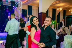 Dance floor scene with professional lighting and elegant venue decor.
