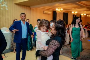 Wedding celebration with guests dancing and enjoying the festive atmosphere.
