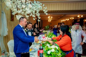 Celebration in progress at an indoor venue with elegant decor and mood lighting.