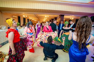 Wedding celebration showing guests dancing and enjoying themselves on the dance floor.