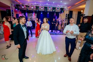 Wedding reception dance floor with guests celebrating under professional stage lighting and truss systems.