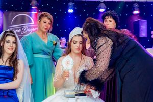 Wedding celebration with sparkly decorations and dramatic blue stage lighting creating an ethereal atmosphere.