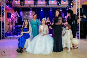 Wedding celebration space with professional lighting and guests enjoying the festivities.
