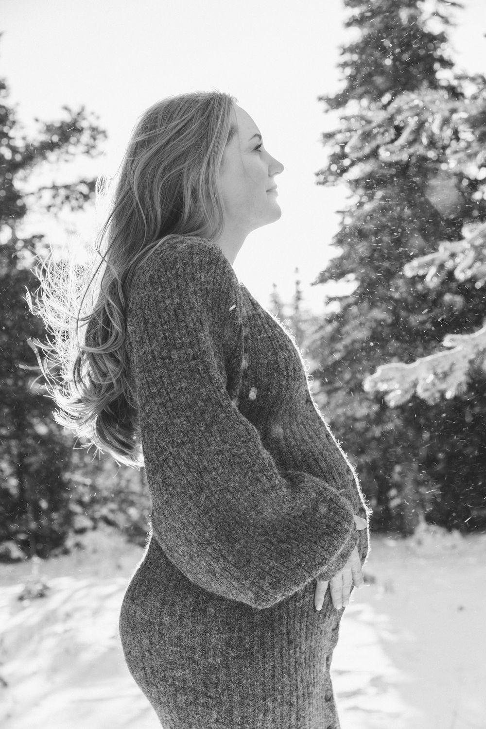 A sequence of winter portraits showing someone in a chunky gray sweater against a snowy forest backdrop.