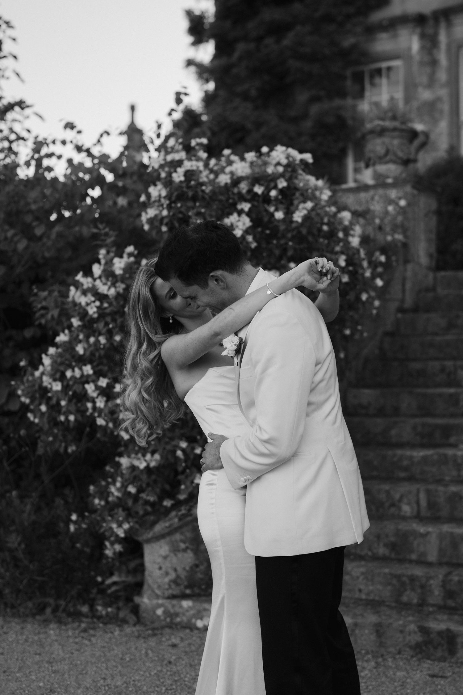 bride and groom embracing in a hug at hamswell house wedding in bath
