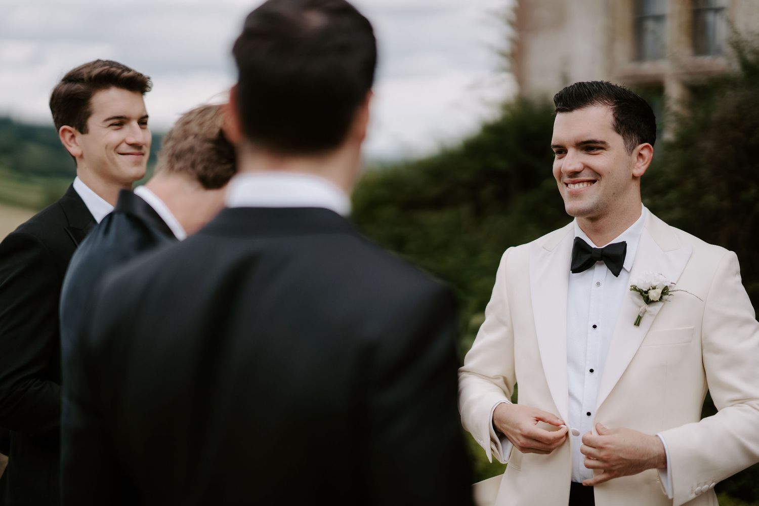 groomsmen talking and laughing at Hamswell house in bath