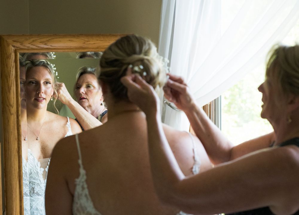 Getting ready in a rustic room with white lace details and elegant preparations for a special occasion.