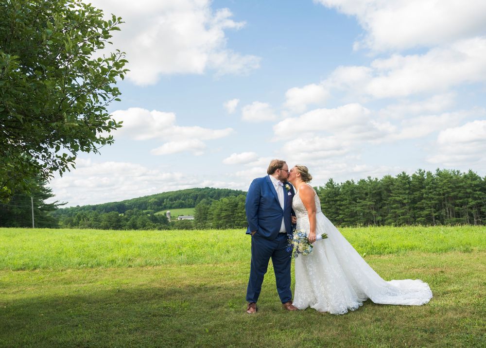A series of romantic outdoor wedding photos captured in a lush green meadow on a sunny summer day.