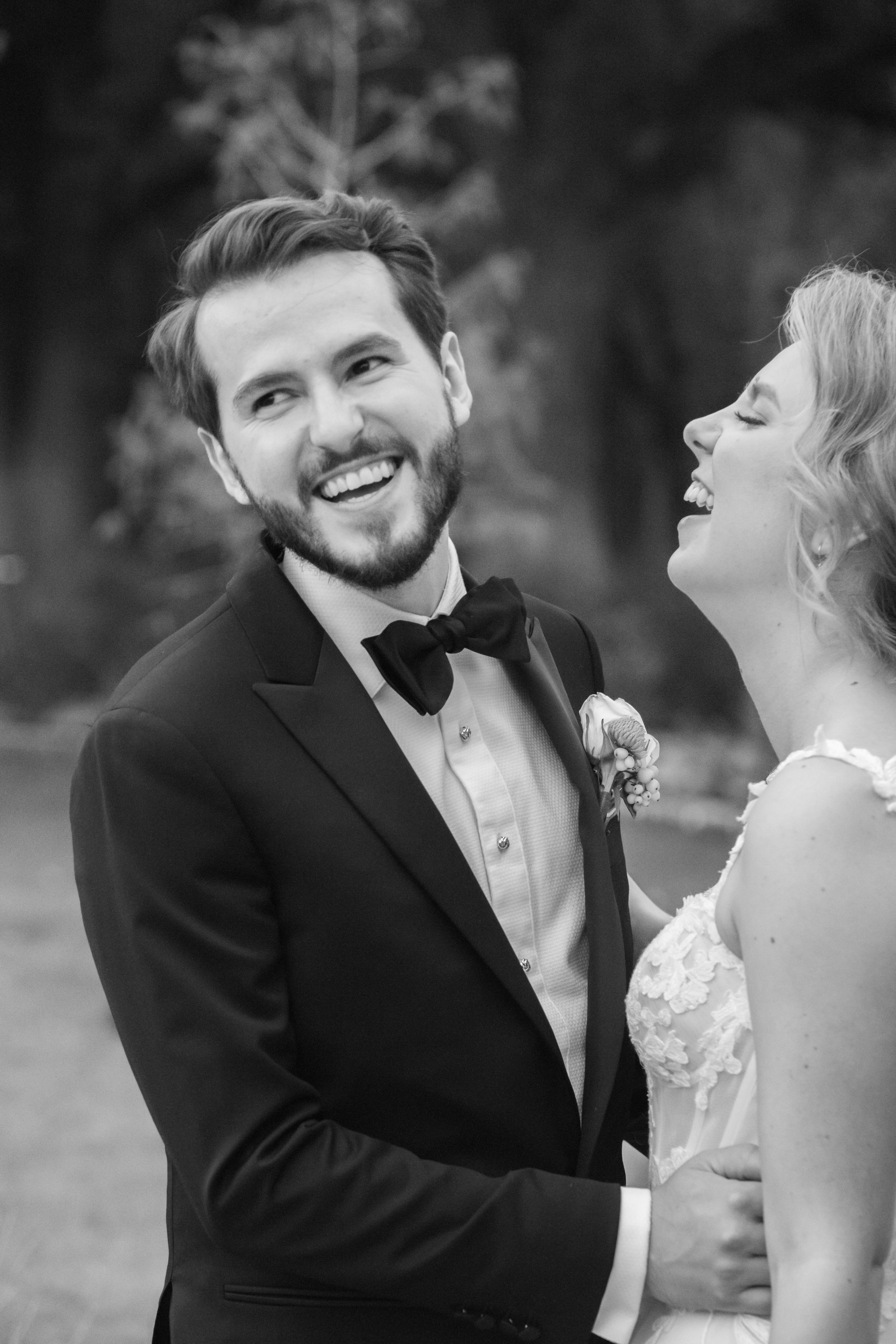 Black and white wedding photo series showing tender moments between newlyweds during their outdoor ceremony.