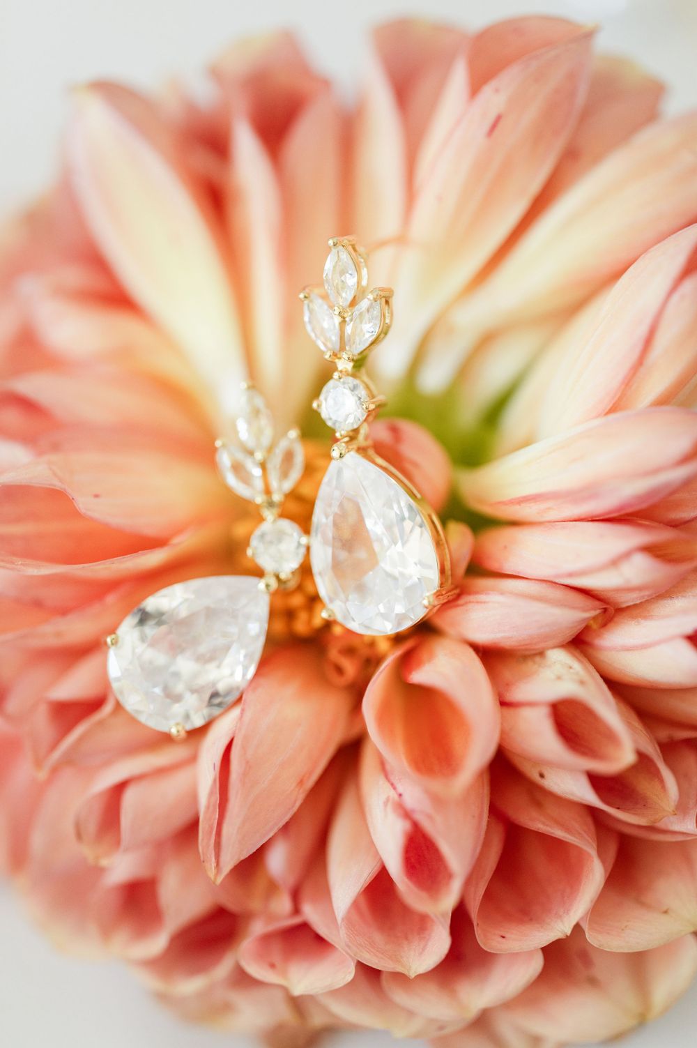 Diamond earrings on pink flower wedding at OSU's St. John Catholic Student Center in Stillwater, Oklahoma.