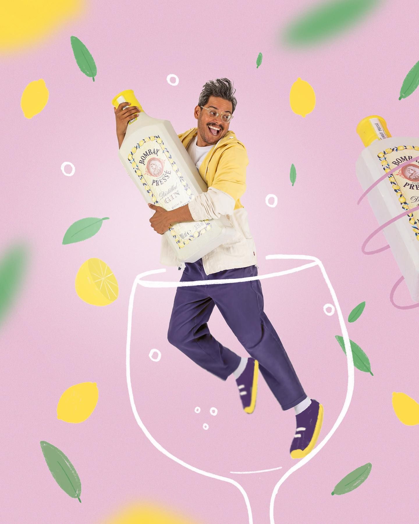 A person in yellow jumps excitedly against a pink background with illustrated wine glass and decorative citrus elements.