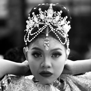 Ornate crystal and pearl headpiece adorning an elegant traditional Asian performance costume.