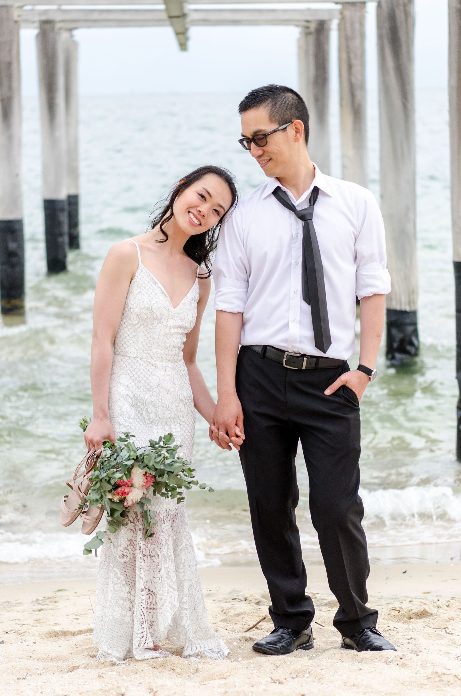 Melbourne photographer Pei A Photography capturing a destination prewedding photo session at St Kilda beach in Melbourne in bridal gown