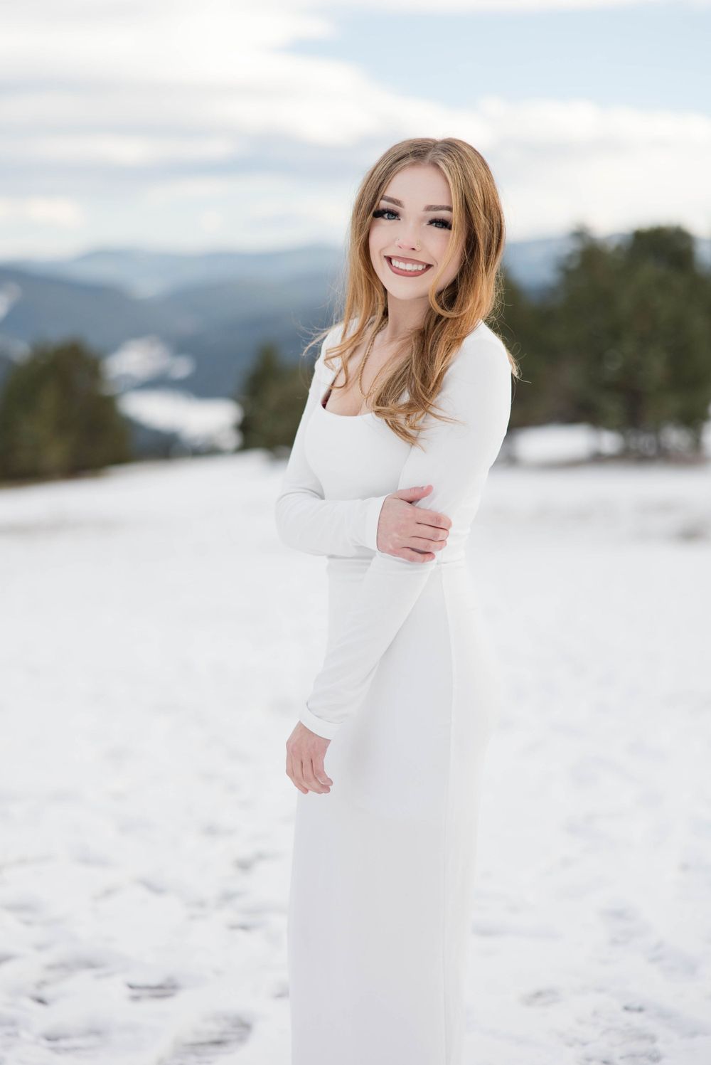 Winter wonderland senior portrait session at Mount Falcon in Morrison, Colorado. Photographed by Kelli Janke Photography.
